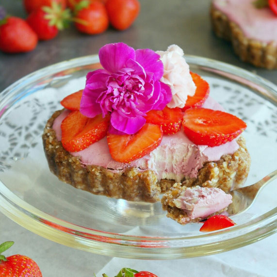 Pink shaped heart tart with raspberries and strawberries