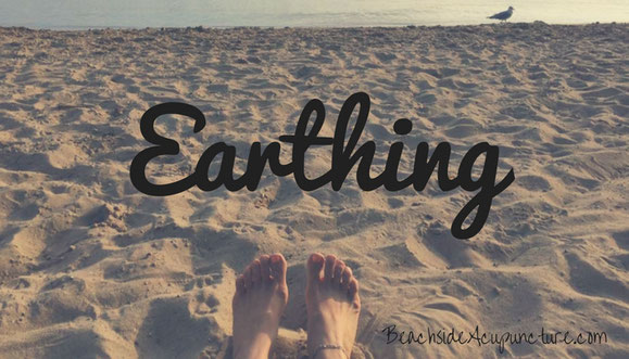 bare feet on beach earthing