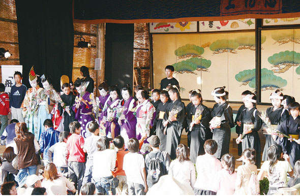 Children receiving flowers from their seniors after a great performance, 2006