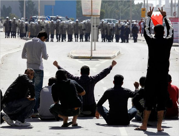 Hamad I Mohammed/Reuters:  Youth protested near police officers in Manama, Bahrain on Monday.