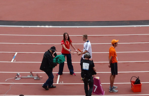 Catherine Hardy handing over the relay baton