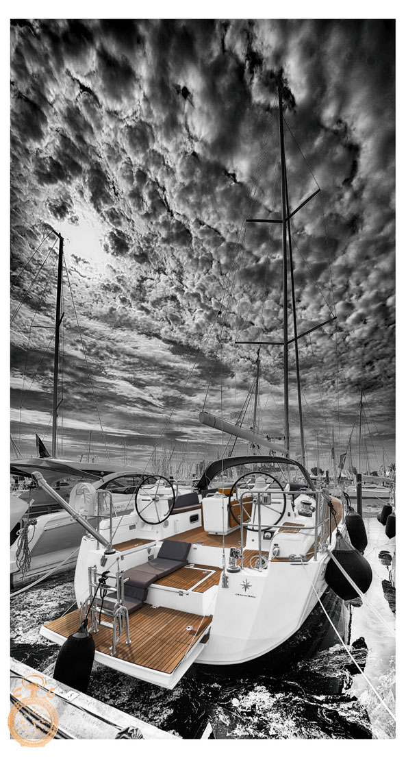 Sailboat in black white against a strong sky, Color Touch Effects