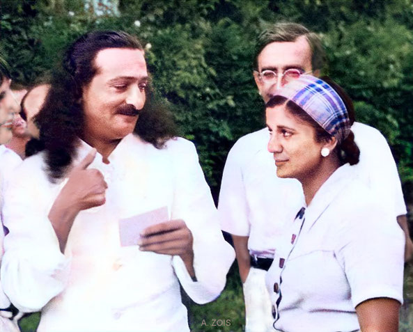 1937 Cannes, France. Meher Baba conversing with Anita de Caro with Chanji behind her & Hedi Mertens far left observing.  Image colourized by Anthony Zois.