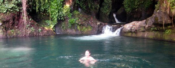 tourist swimming in the river-pool