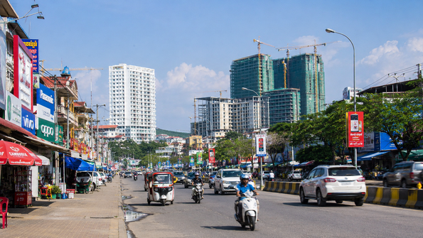 Street scene in Sihanoukville showing current development, traffic, and everyday local life