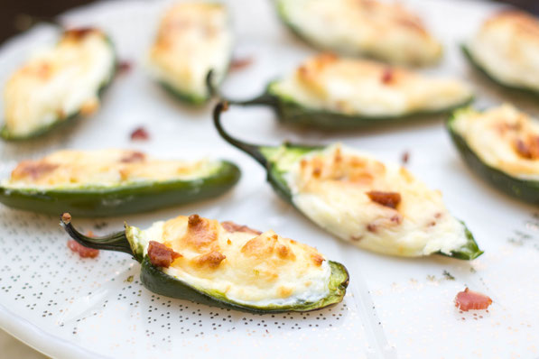 These lighter bacon cream cheese stuffed jalapeno poppers are the best appetizer recipe!  Everyone will love them and no one will notice they're a healthier snack option! 