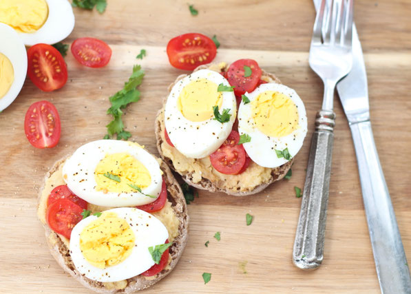 This tasty twist on an egg sandwich is a flavorful and filling way to start the day!  Eggs, hummus, and a whole grain English muffin are the base of this quick, high protein breakfast recipe!  