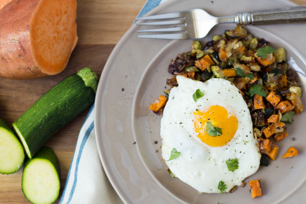 This simple, delicious seven-ingredient vegetarian roasted veggie hash with eggs is the perfect healthy breakfast-for-dinner recipe! 