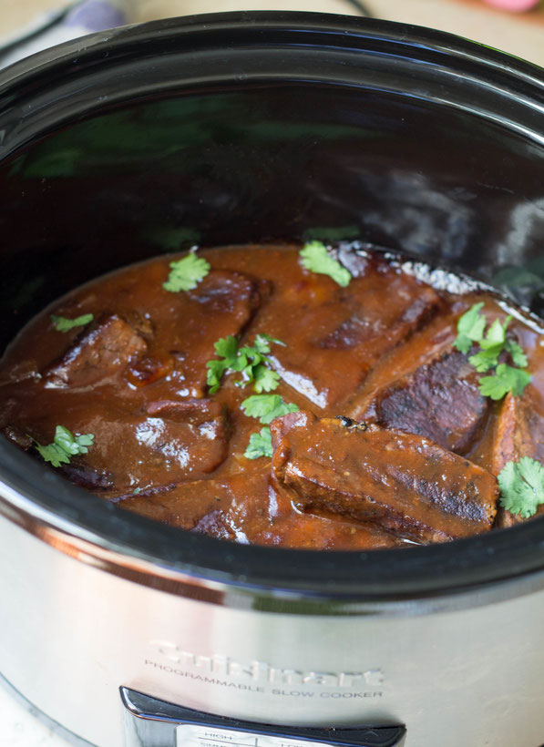 This easy recipe for slow cooker BBQ beef ribs is one of the most requested recipes by family and friends when we have company over.  And the best part is, it takes only  a few minutes to prep, and the result is this beautiful dish everyone will love!