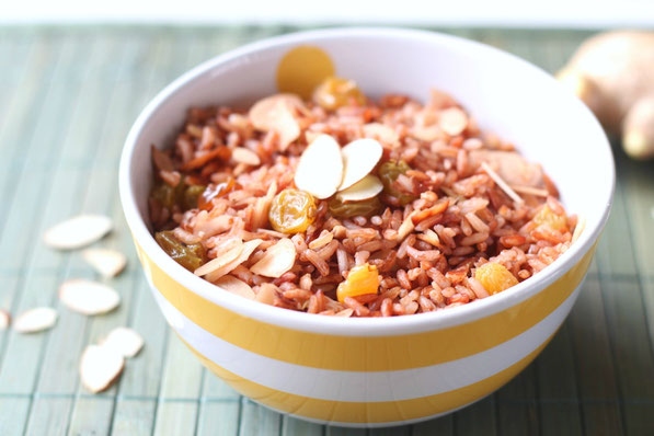 Fresh ginger, almonds, and golden raisins make this easy pink rice pilaf extra special!