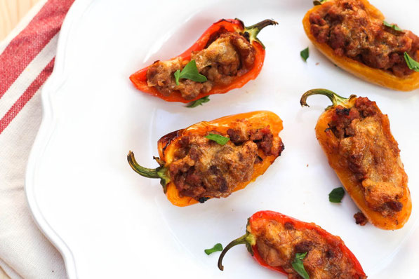 Taco pepper poppers are a fun mix between tacos and jalapeno poppers. Sweet mini peppers make this a flavorful family-friendly (non-spicy) option for dinner, snacks, or appetizers. Perfect healthy game-watching recipe!