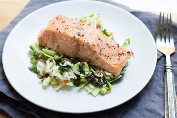 This easy baked salmon with chopped salad is a high protein, gluten free, and low carb recipe for lunch or dinner. It also only has two main ingredients and takes just a few minutes to make!