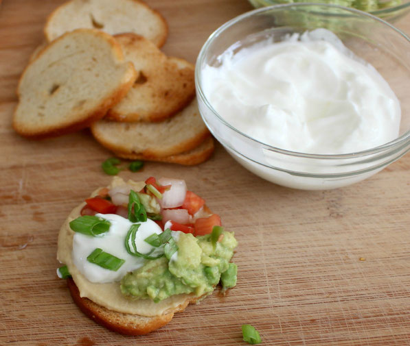 This is an easy recipe that's perfect for tailgating season!  A few simple store-bought items come together in minutes to make these Southwestern hummus bites.  Everyone will love this tasty, healthy snack!