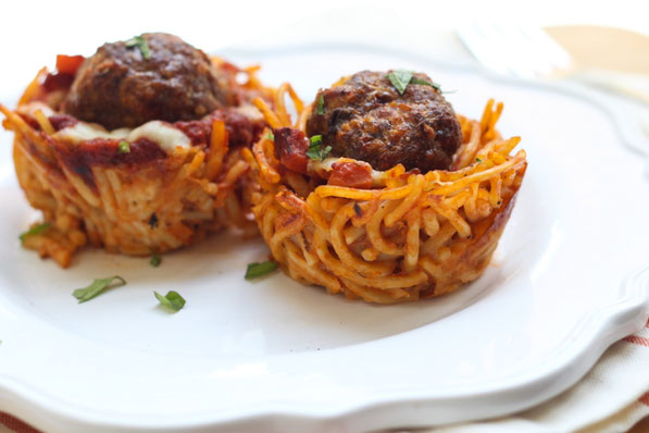 This fun version of spaghetti and meatballs is baked in a muffin tin to make "nests." It's a beautiful, perfectly portioned dinner the whole family will love! 