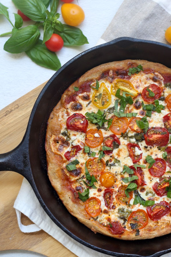 This light and healthy tomato and cheese skillet pizza is the perfect family-friendly vegetarian dinner recipe!