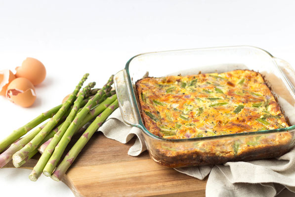 Fresh asparagus makes the perfect veggie base for this cheesy ham and egg casserole! 