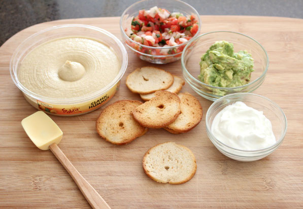 This is an easy recipe that's perfect for tailgating season!  A few simple store-bought items come together in minutes to make these Southwestern hummus bites.  Everyone will love this tasty, healthy snack!