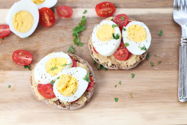 This tasty twist on an egg sandwich is a flavorful and filling way to start the day!  Eggs, hummus, and a whole grain English muffin are the base of this quick, high protein breakfast recipe!  