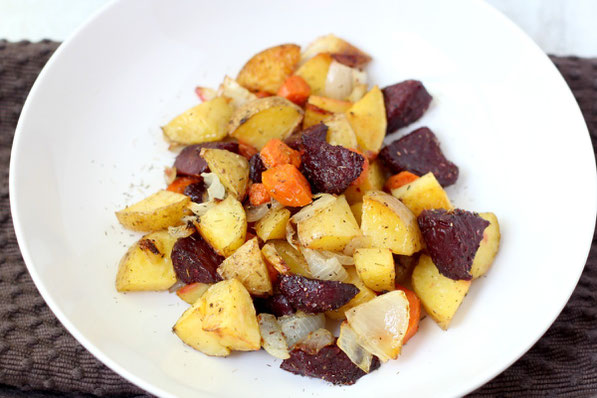 This beautiful medley of roasted beets, potatoes, and carrots with garlic-thyme seasoning makes for one delicious side dish!