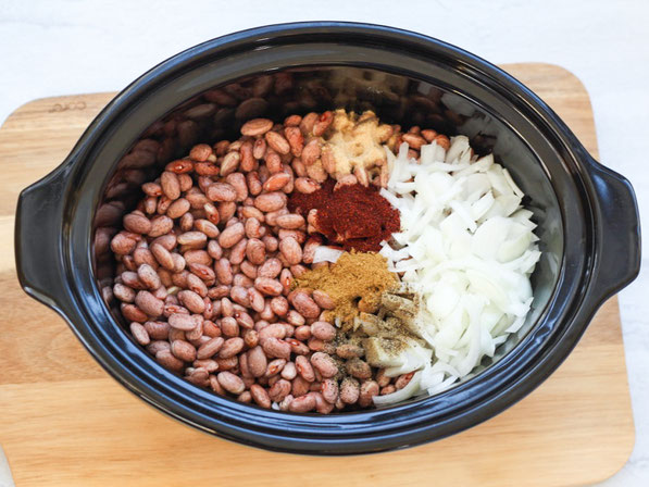 Creamy, flavorful refried beans are so easy to make in the slow cooker! These refried beans are a healthier, vegan version of classic refried beans that the whole family will love!