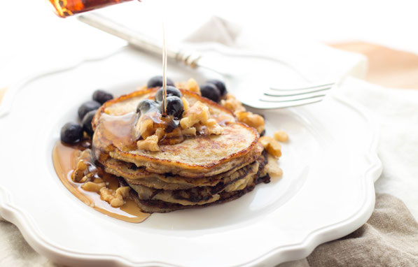 These easy gluten-free blueberry walnut banana pancakes are a healthy, high-protein (and tasty) breakfast recipe!