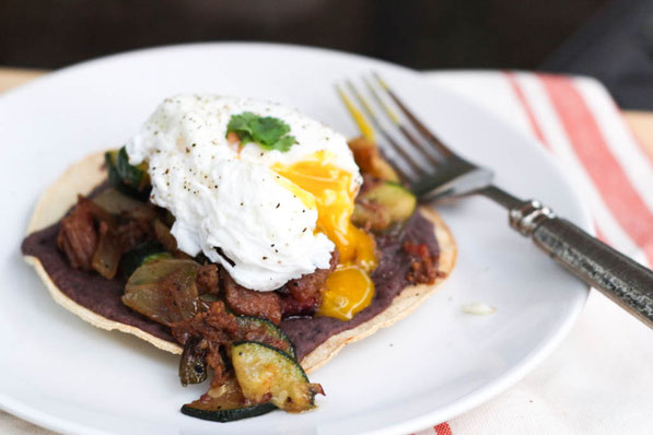 These tasty tostadas with beef, zucchini, black beans, and a poached egg are a tasty way to turn last night's beef dinner into a delicious high protein breakfast!