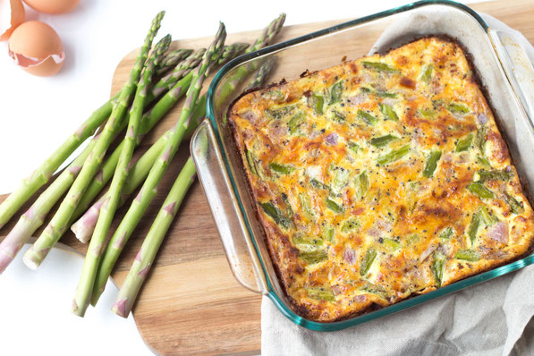 Fresh asparagus makes the perfect veggie base for this cheesy ham and egg casserole! 