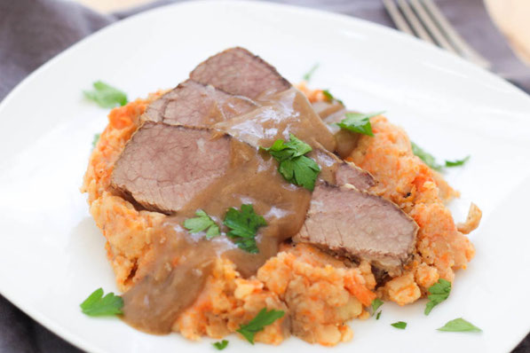 This slow cooker beef brisket with mashed potatoes, carrots, and onions is a beautiful family-friendly comfort dish!  It's a classic recipe made a little lighter and takes only a few minutes to prep! 