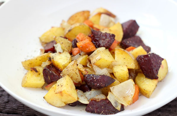 This beautiful medley of roasted beets, potatoes, and carrots with garlic-thyme seasoning makes for one delicious side dish!