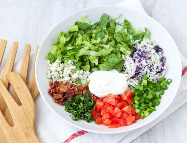 This chopped salad is lighter than most chopped salad recipes, but still has a few "treats" making it a fun and delicious way to enjoy those veggies!