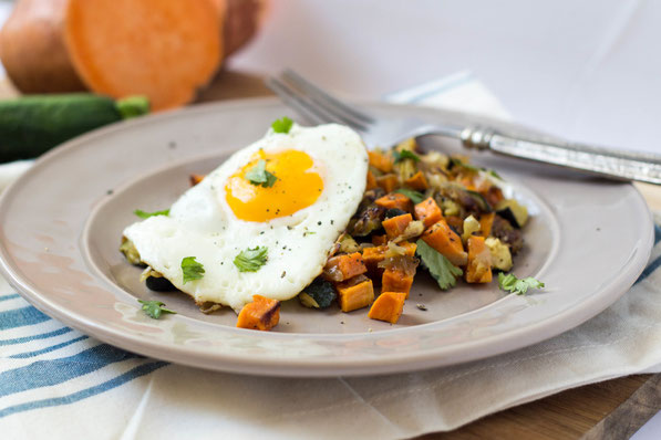 This simple, delicious seven-ingredient vegetarian roasted veggie hash with eggs is the perfect healthy breakfast-for-dinner recipe!