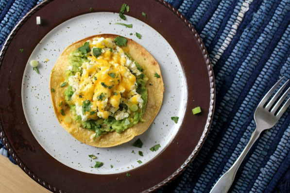 Easy and healthy vegetarian recipe for avocado, egg, and cheese breakfast tostadas!