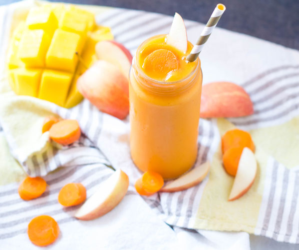 This carrot, mango, and ginger smoothie is packed with vitamins, minerals and fiber and makes for a flavorful boost of nutrition first thing in the morning! This vegan carrot, mango, and ginger smoothie is packed with vitamins, minerals and fiber. It's