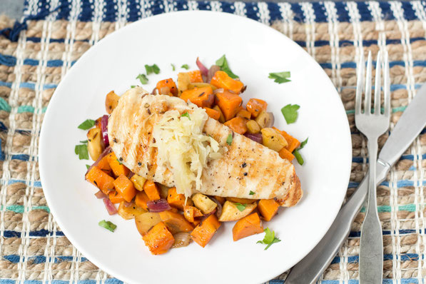 Roasted sweet potatoes, apple, and onion complement this marinated orange-maple chicken perfectly.  Serve with raw sauerkraut for a boost of nutrition and probiotics for this healthy dinner! 