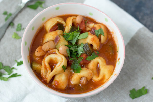 This simple 20-minute soup is perfect for a busy day!  Cheese tortellini, white beans, zucchini, and Italian spices make for one tasty and family-friendly vegetarian dinner! 