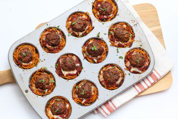 This fun version of spaghetti and meatballs is baked in a muffin tin to make "nests." It's a beautiful, perfectly portioned dinner the whole family will love! 