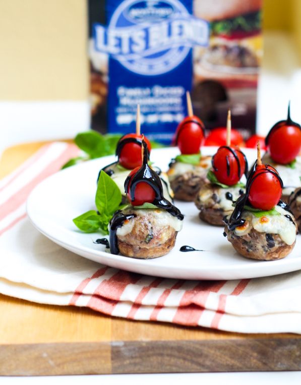 Caprese-stuffed mushroom cheeseburger bites are a fun, flavorful, and lighter appetizer perfect for football season!  #homemadenutrition #mushrooms #AD