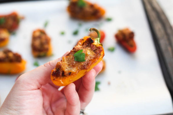 Taco pepper poppers are a fun mix between tacos and  jalapeno poppers.  Sweet mini peppers make this a flavorful family-friendly (non-spicy) option for dinner, snacks, or appetizers.  Perfect healthy game-watching recipe! 