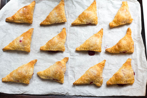 These mini cranberry-orange turnovers are a festive and flavorful dessert for holiday gatherings!