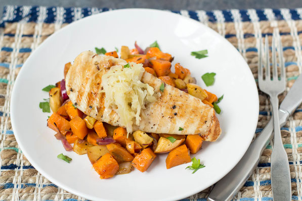 Roasted sweet potatoes, apple, and onion complement this marinated orange-maple chicken perfectly.  Serve with raw sauerkraut for a boost of nutrition and probiotics for this healthy dinner! 