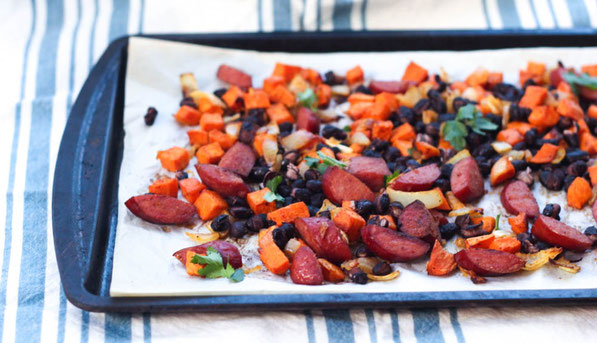 Sausage, sweet potato, onions, and black beans roast together  beautifully on a baking sheet to create the base of these delicious  (and gluten free) one-pan tacos for two!  