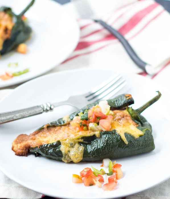 These easy vegetarian roasted poblano peppers stuffed with beans and cheese are a lighter twist on traditional chile rellenos.  They have only five ingredients and are ready in about 30 minutes!  Perfect gluten free weeknight dinner!