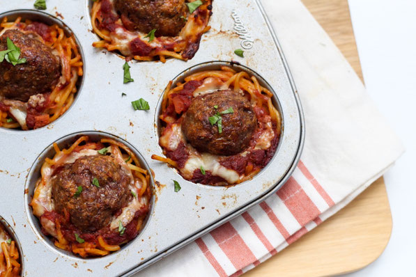 This fun version of spaghetti and meatballs is baked in a muffin tin to make "nests." It's a beautiful, perfectly portioned dinner the whole family will love! 