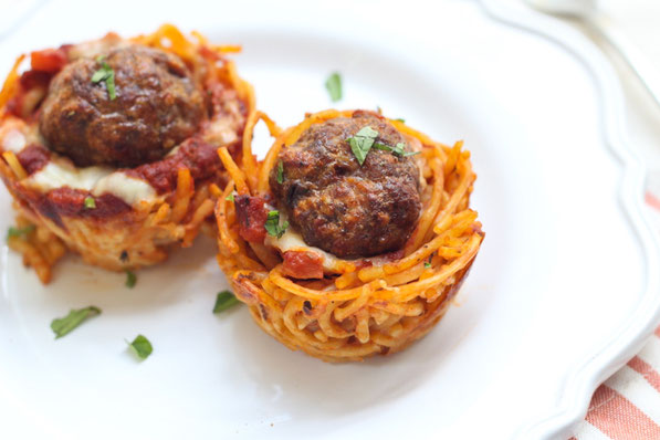 This fun version of spaghetti and meatballs is baked in a muffin tin to make "nests." It's a beautiful, perfectly portioned dinner the whole family will love! 