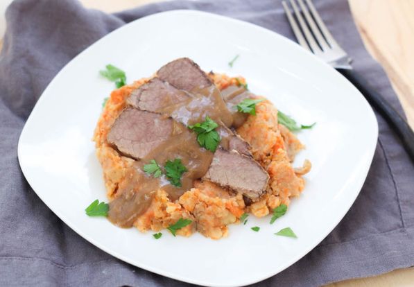 This slow cooker beef brisket with mashed potatoes, carrots, and onions is a beautiful family-friendly comfort dish! It's a classic recipe made a little lighter and takes only a few minutes to prep!
