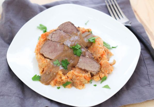 This slow cooker beef brisket with mashed potatoes, carrots, and onions is a beautiful family-friendly comfort dish!  It's a classic recipe made a little lighter and takes only a few minutes to prep! 