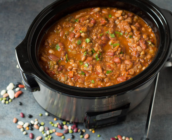 This hearty slow cooker sixteen bean and sausage soup recipe is the perfect healthy make-ahead lunch or dinner for a busy week! 