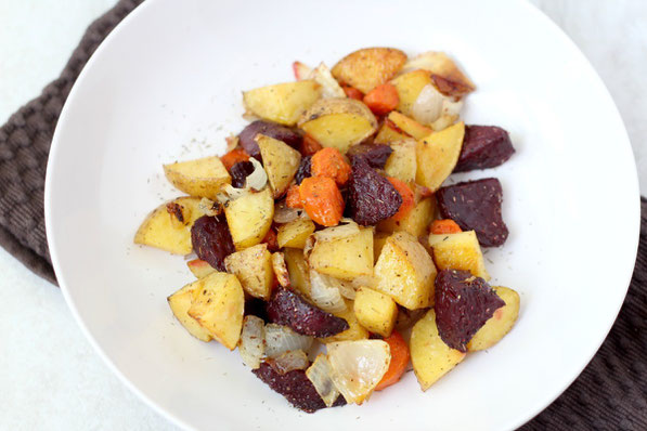 This beautiful medley of roasted beets, potatoes, and carrots with garlic-thyme seasoning makes for one delicious side dish!