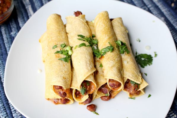 These baked vegetarian chili cheese taquitos are the perfect quick healthy weeknight dinner recipe! They're ready in about 20 minutes and are very family friendly!