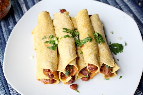 These baked vegetarian chili cheese taquitos are the perfect quick healthy weeknight dinner recipe!  They're ready in about 20 minutes and are very family friendly! 